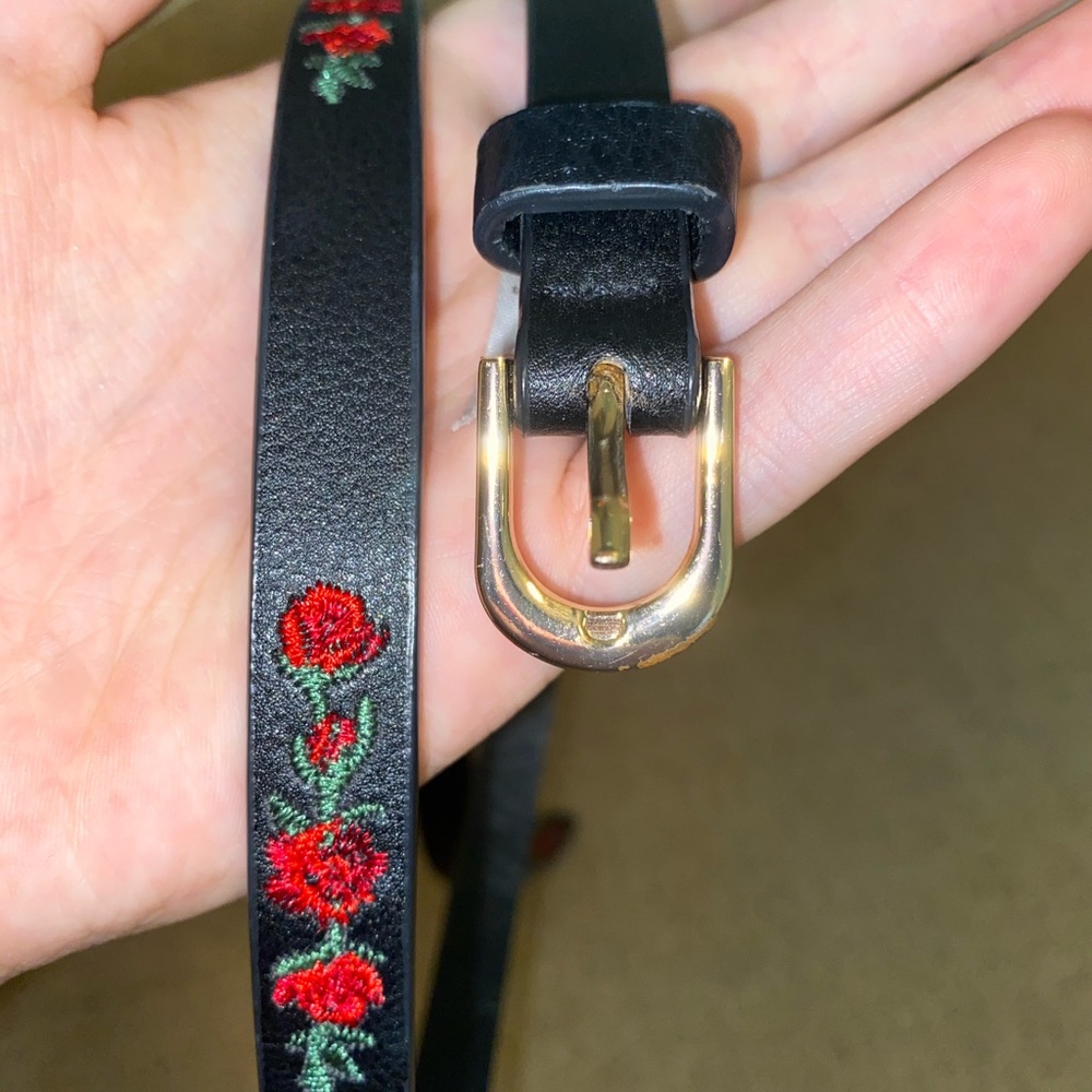 belt with rose stitching and gold buckle